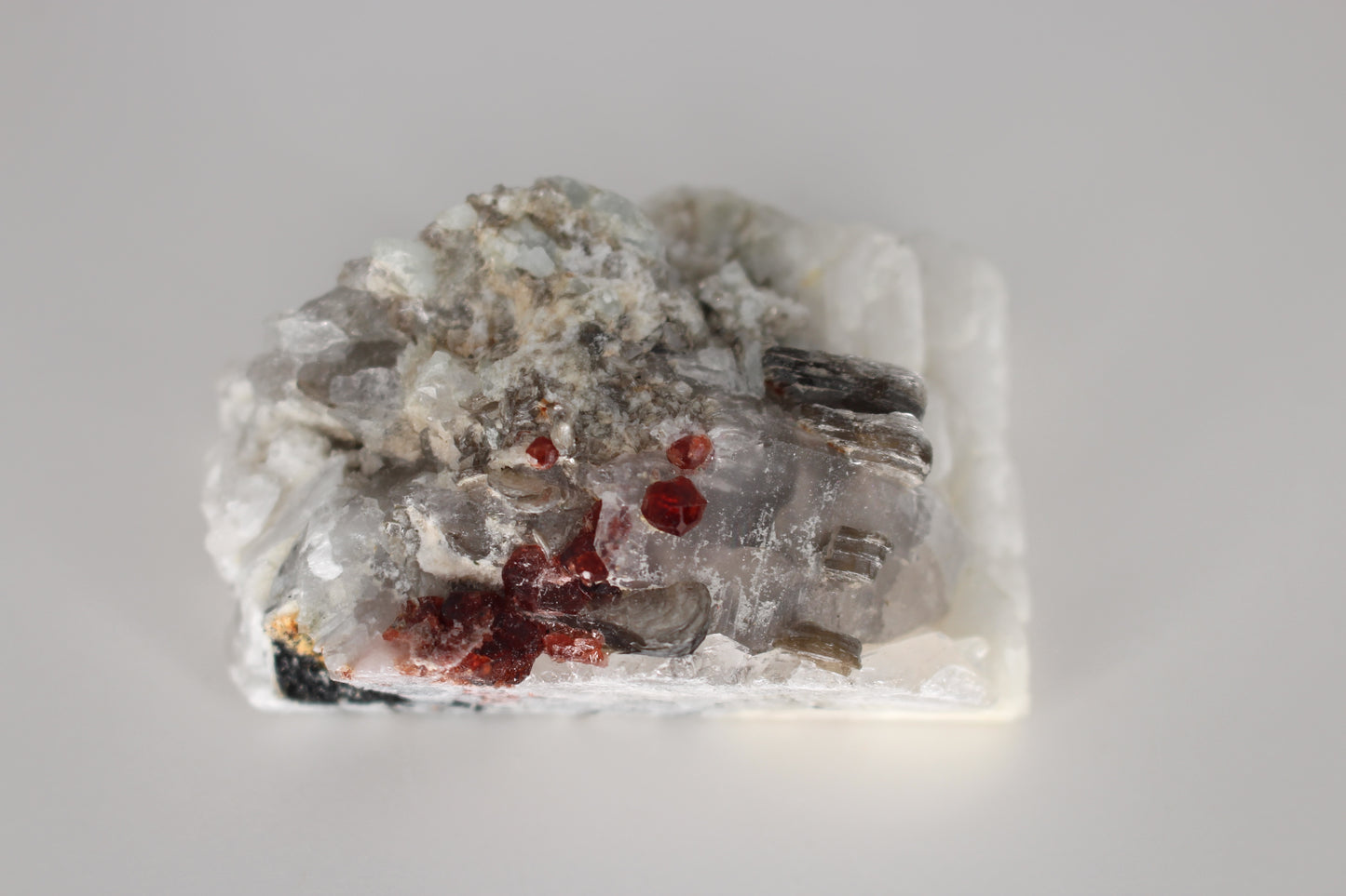 Spessartine Garnets on Quartz w/ Mica, Feldspar and Schorl