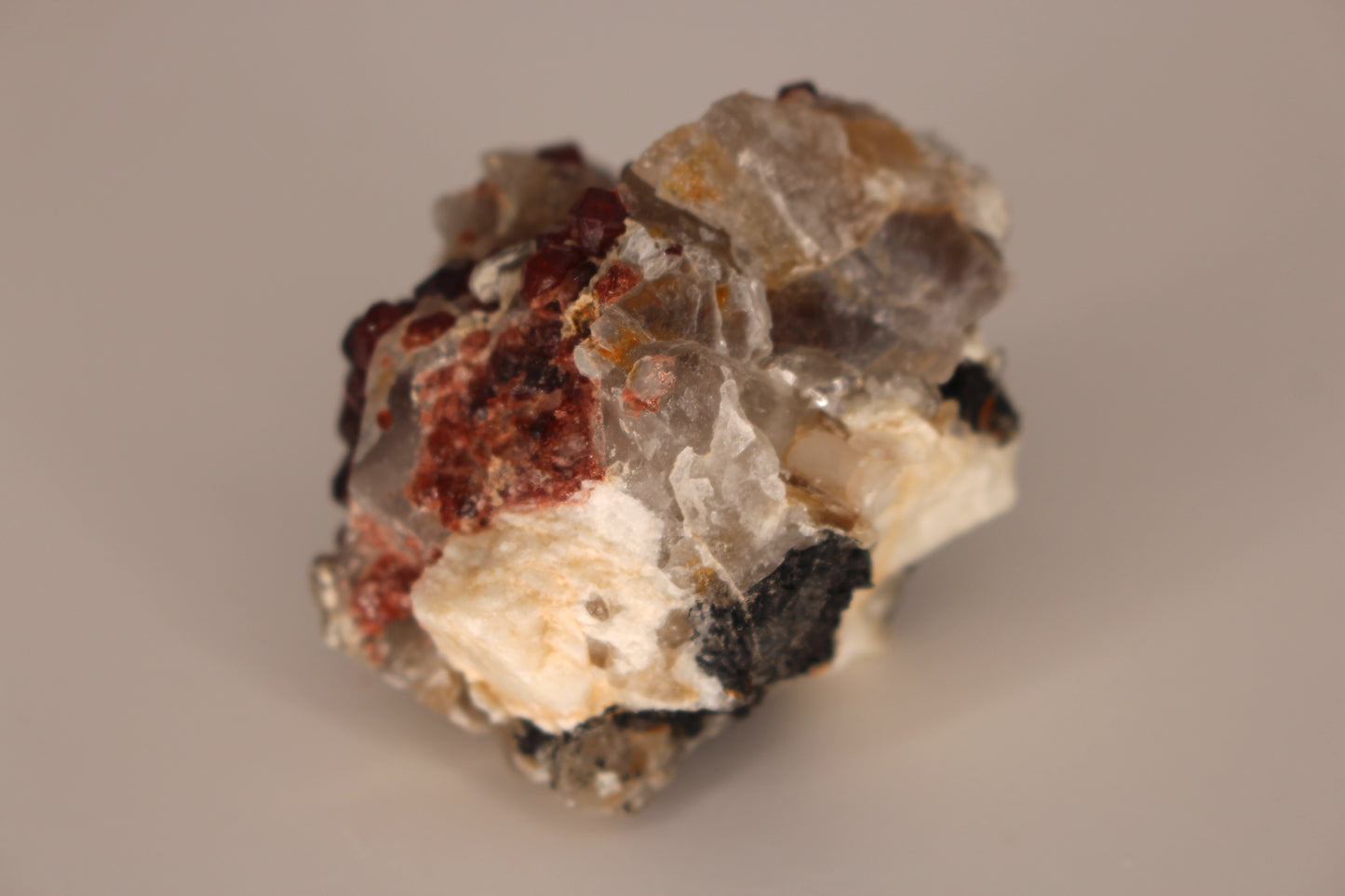 Spessartine Garnets on Quartz w/ Mica, Feldspar and Schorl