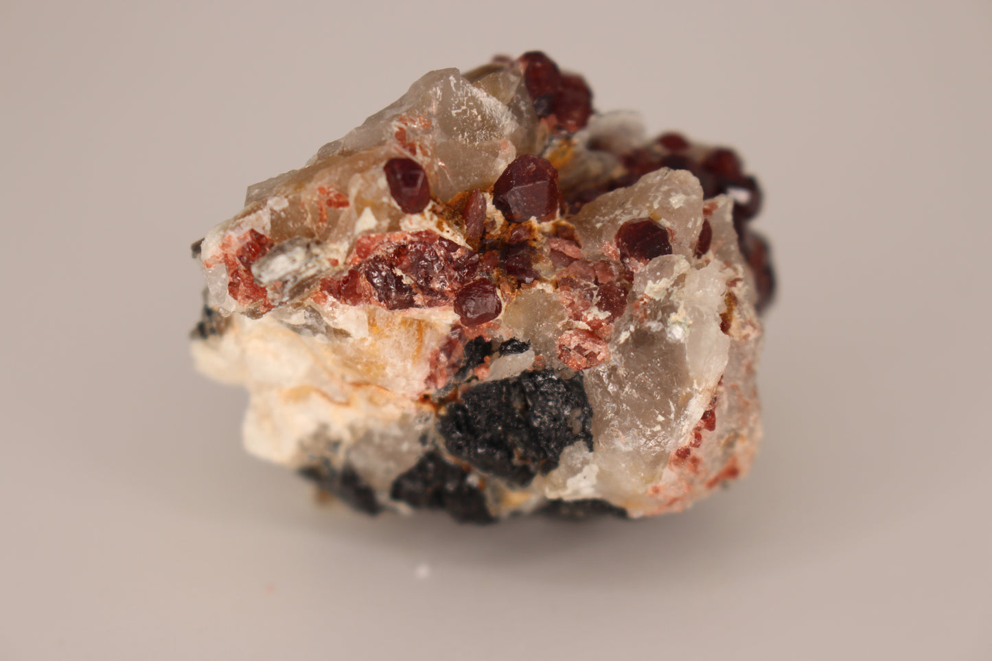 Spessartine Garnets on Quartz w/ Mica, Feldspar and Schorl