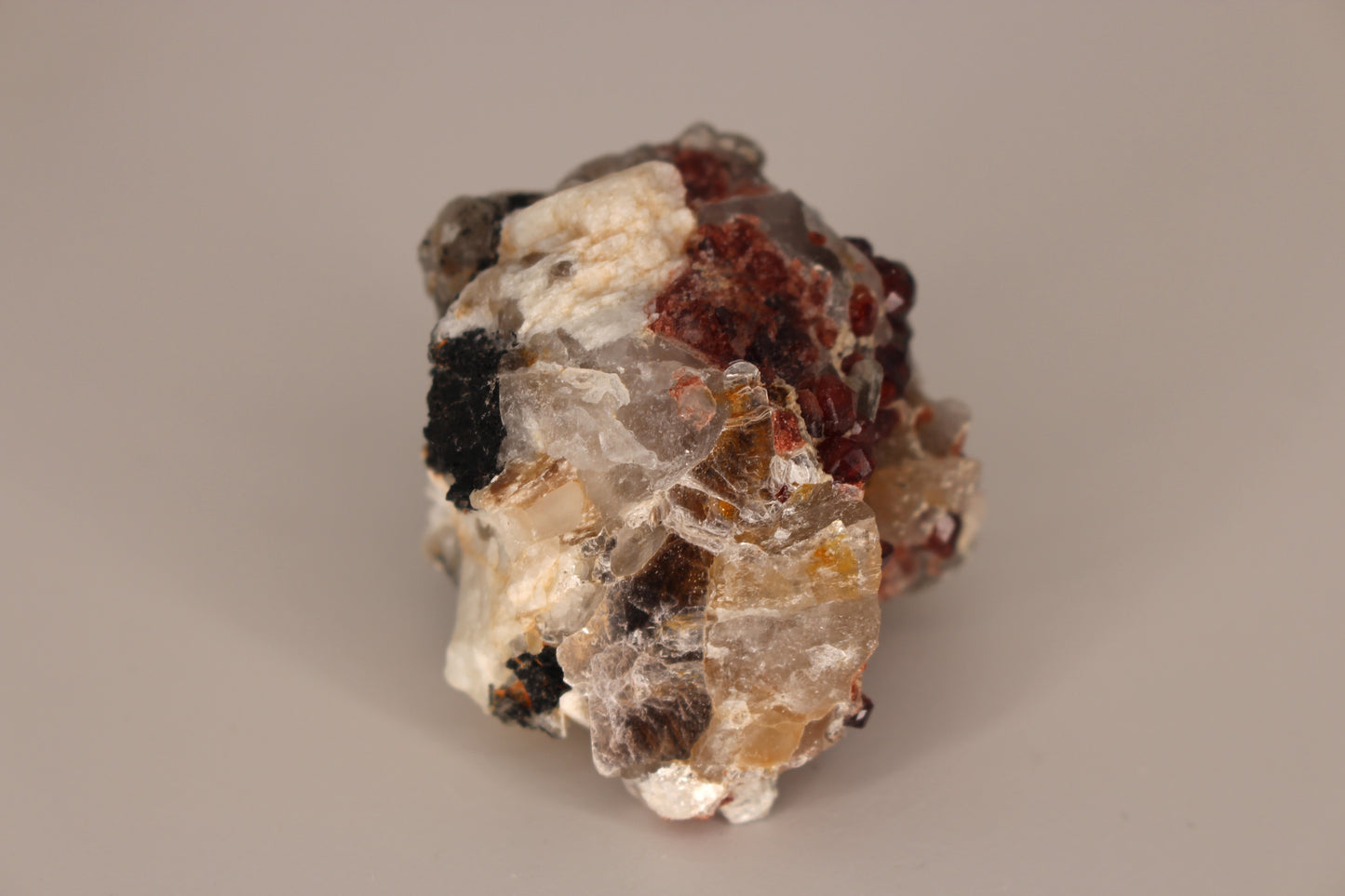 Spessartine Garnets on Quartz w/ Mica, Feldspar and Schorl