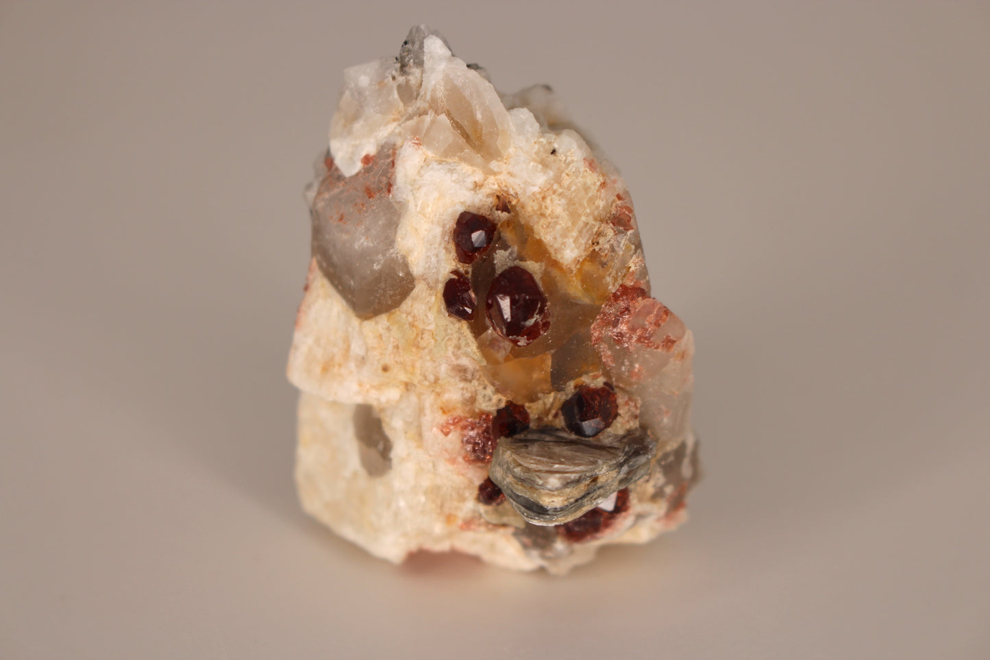 Spessartine Garnets on Quartz w/ Mica and Feldspar