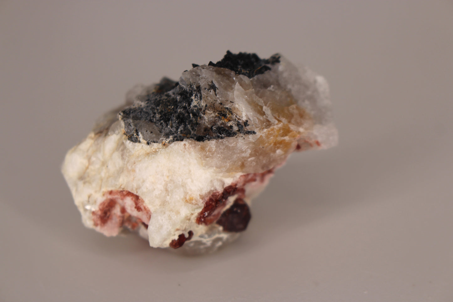 Spessartine Garnets on Quartz w/ Feldspar and Schorl