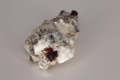 Etched Spessartine Garnet on Feldspar w/ Mica