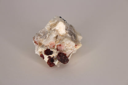 Spessartine Garnets on Quartz w/ Mica, Feldspar and Schorl