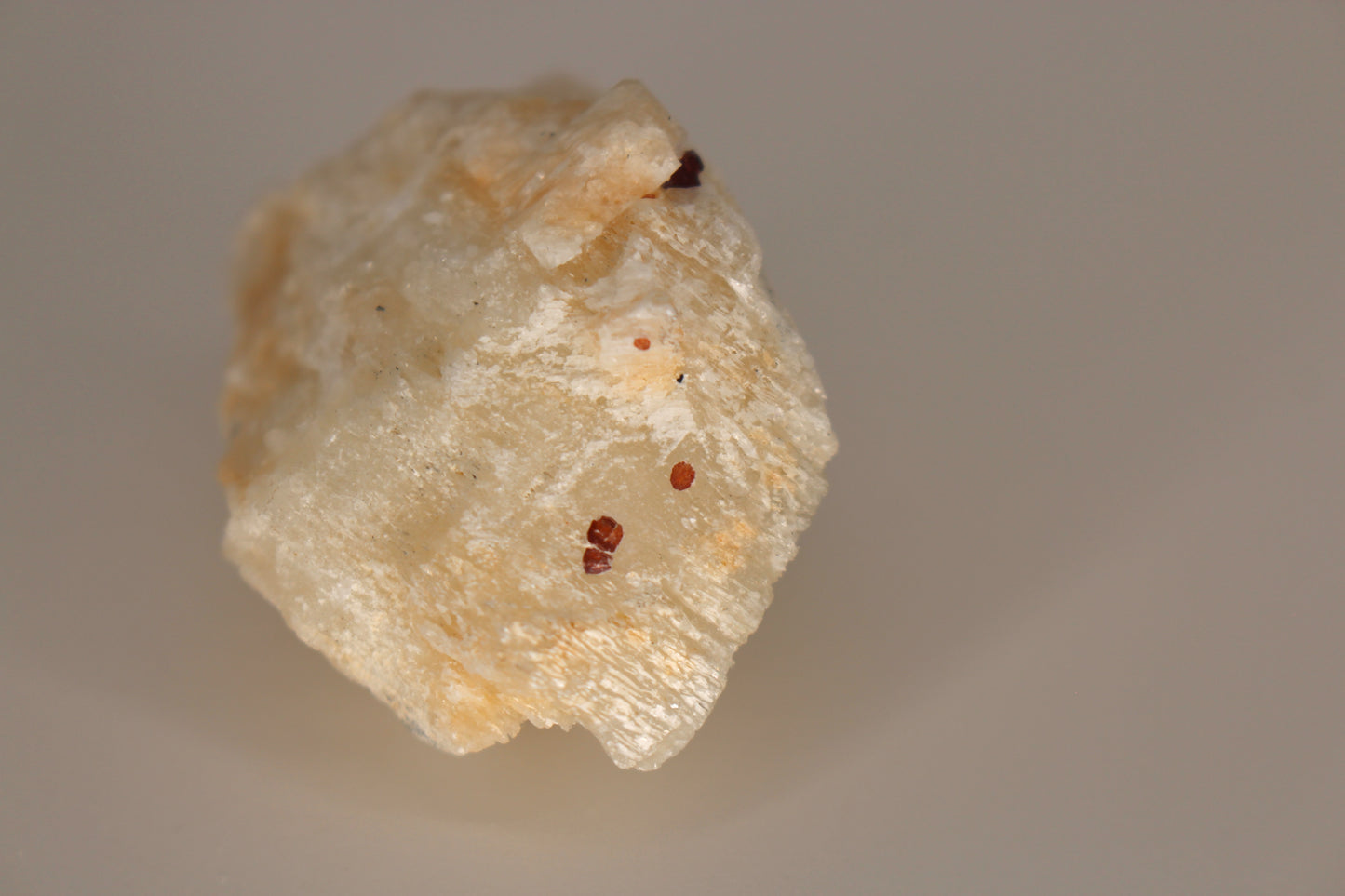 Etched Spessartine Garnet on Feldspar