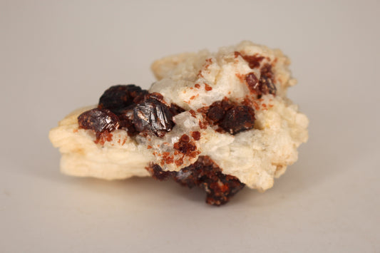 Etched Spessartine Garnet on Feldspar