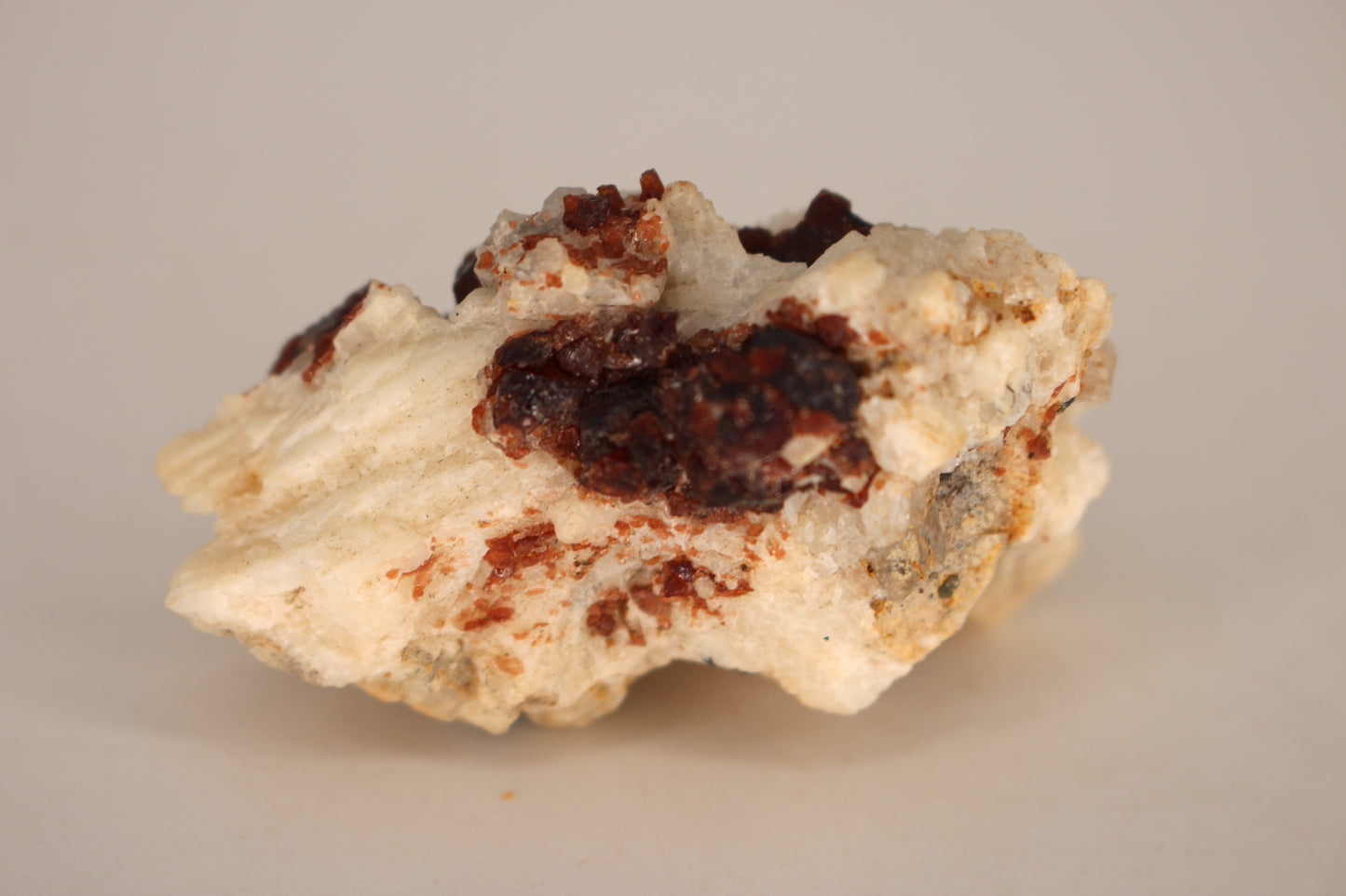 Etched Spessartine Garnet on Feldspar