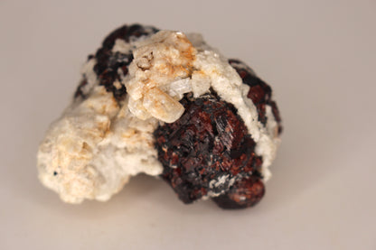 Etched Spessartine Garnet on Feldspar