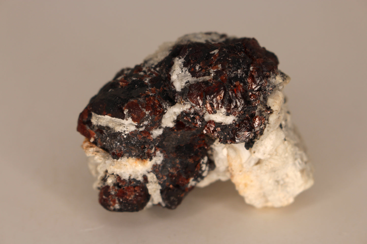 Etched Spessartine Garnet on Feldspar